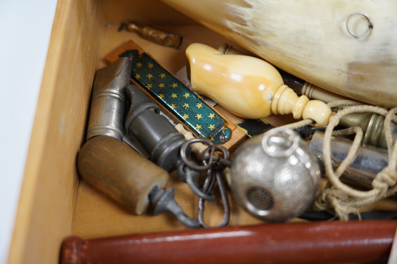 A collection of whistles including a horn example, a tin whistle, novelty bird whistles, etc. Condition - fair